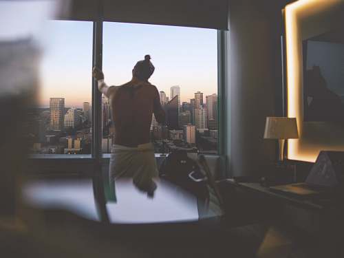 interior design man standing beside window during daytime housing